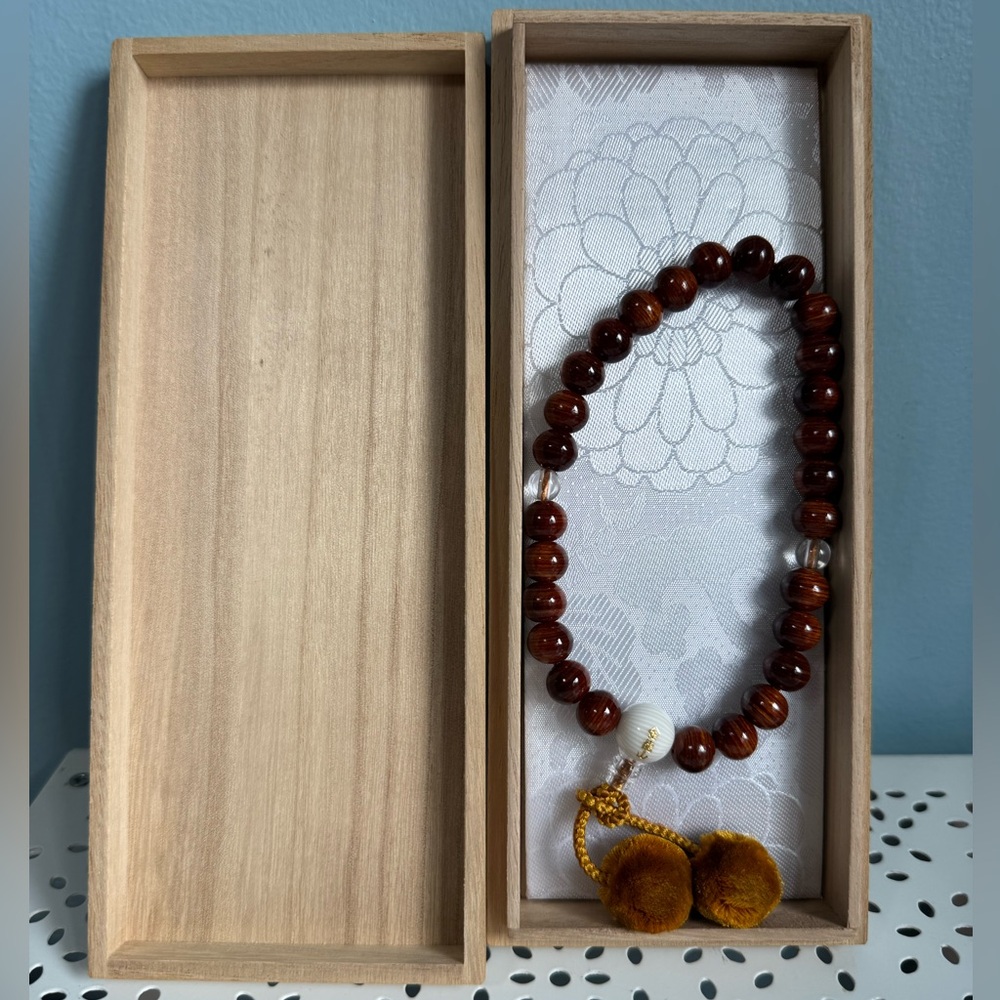Japanese prayer beads in box.